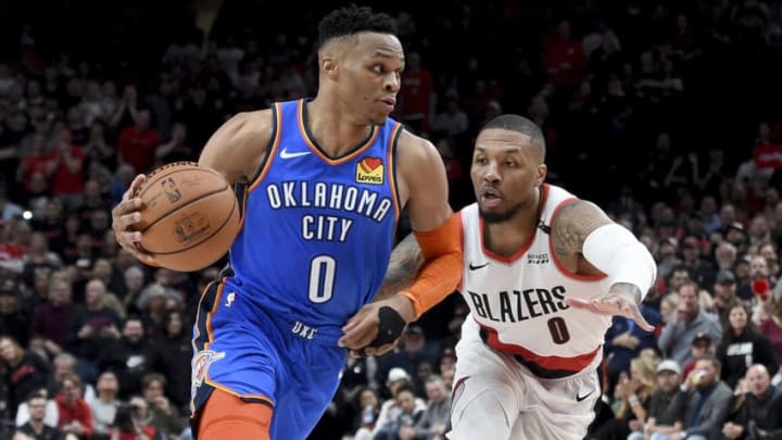 PORTLAND, OR - APRIL 14: Russell Westbrook #0 of the Oklahoma City Thunder drives to the basket on Damian Lillard #0 of the Portland Trail Blazers during the second half of the game at the Moda Center on April 14, 2019 in Portland, Oregon. The Blazers won 104-99. NOTE TO USER: User expressly acknowledges and agrees that, by downloading and or using this photograph, User is consenting to the terms and conditions of the Getty Images License Agreement. (Photo by Steve Dykes/Getty Images)