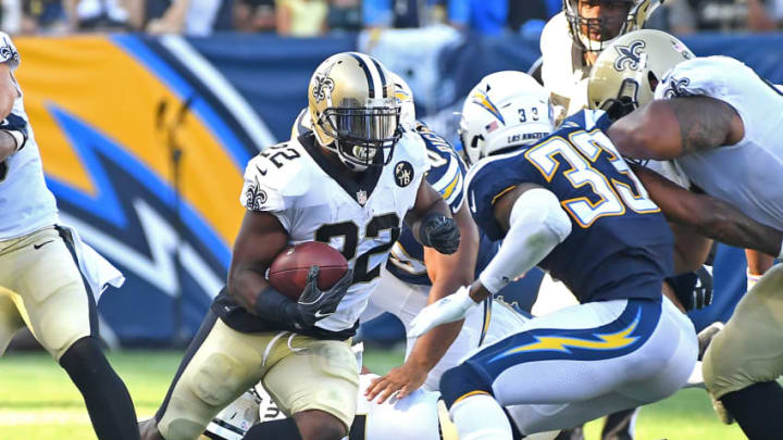 CARSON, CA - AUGUST 25: Mark Ingram #22 of the New Orleans Saints gets past Derwin James #33 of the Los Angeles Chargers for a gain in the second quarter of the pre-season game at StubHub Center on August 25, 2018 in Carson, California. (Photo by Jayne Kamin-Oncea/Getty Images)
