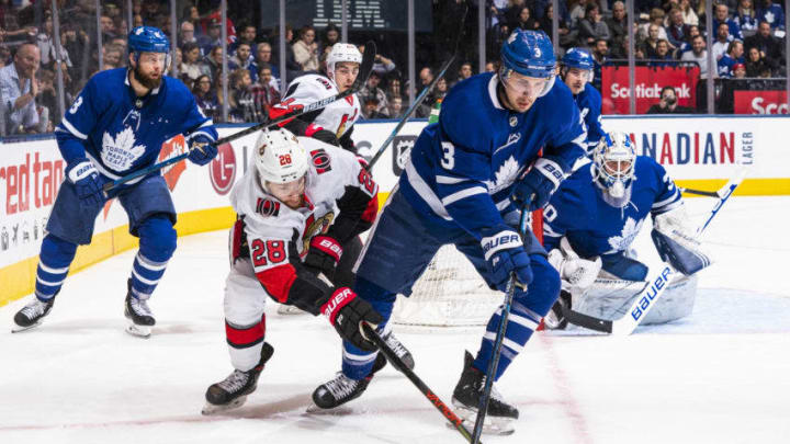 TORONTO, ON - FEBRUARY 1: Connor Brown #28 of the Ottawa Senators battles for the puck against Justin Holl #3 of the Toronto Maple Leafs during the first period at the Scotiabank Arena on February 1, 2020 in Toronto, Ontario, Canada. (Photo by Kevin Sousa/NHLI via Getty Images)