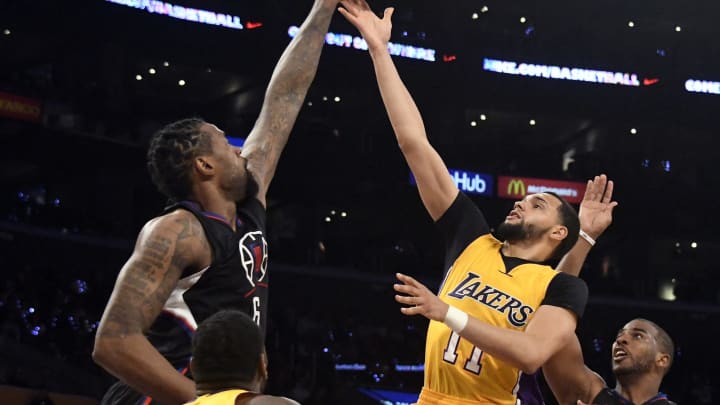Mar 21, 2017; Los Angeles, CA, USA; Los Angeles Lakers guard Tyler Ennis (11) shoots against LA Clippers center DeAndre Jordan (6) in the second half at Staples Center. Mandatory Credit: Richard Mackson-USA TODAY Sports