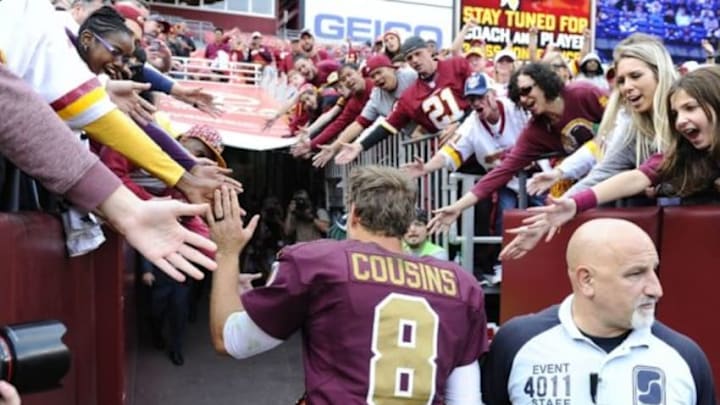 Oct 25, 2015; Landover, MD, USA; Washington Redskins quarterback Kirk Cousins (8) is congratulated by fans after the game between the Washington Redskins and the Tampa Bay Buccaneers at FedEx Field. The Washington Redskins won 31 - 30. Mandatory Credit: Brad Mills-USA TODAY Sports