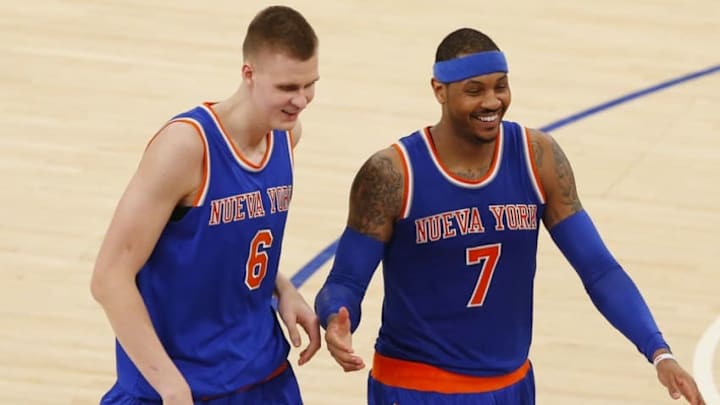 Mar 24, 2016; New York, NY, USA; New York Knicks forward Kristaps Porzingis (6) and forward Carmelo Anthony (7) laugh on the court during second half time out against the Chicago Bulls at Madison Square Garden. The Knicks won 106-94. Mandatory Credit: Noah K. Murray-USA TODAY Sports Mar 24, 2016; New York, NY, USA; New York Knicks forward Kristaps Porzingis (6) and forward Carmelo Anthony (7) laugh on the court during second half time out against the Chicago Bulls at Madison Square Garden. The Knicks won 106-94. Mandatory Credit: Noah K. Murray-USA TODAY Sports