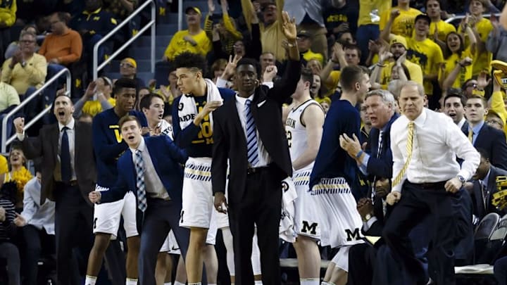 Mar 5, 2016; Ann Arbor, MI, USA; Michigan Wolverines head coach John Beilein (right) and players celebrate a three point basket in the first half against the Iowa Hawkeyes at Crisler Center. Mandatory Credit: Rick Osentoski-USA TODAY Sports