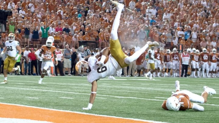 Sep 4, 2016; Austin, TX, USA; Notre Dame Fighting Irish wide receiver Equanimeous St. Brown (6) flips into the end zone for a touchdown in front of Texas Longhorns safety Dylan Haines (14) in the second quarter at Darrell K. Royal-Texas Memorial Stadium. Mandatory Credit: Matt Cashore-USA TODAY Sports