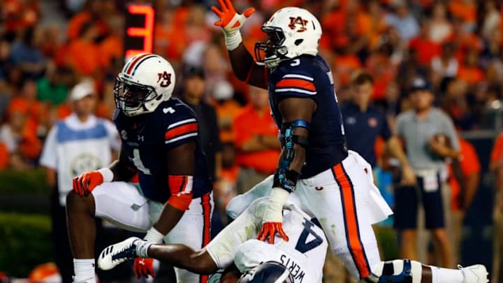 AUBURN, AL - SEPTEMBER 2: Defensive lineman Marlon Davidson #3 and linebacker Jeff Holland #4 of the Auburn Tigers celebrate after sacking quarterback Shai Werts #4 of the Georgia Southern Eagles during the second half of an NCAA college football game at Jordan Hare Stadium on Saturday, September 2, 2017 in Auburn, Alabama. (Photo by Butch Dill/Getty Images)