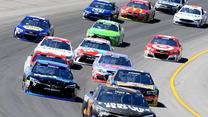 Jun 12, 2016; Brooklyn, MI, USA; NASCAR Sprint Cup Series driver Martin Truex Jr. (78) races during the FireKeepers Casino 400 at Michigan International Speedway. Mandatory Credit: Mike DiNovo-USA TODAY Sports