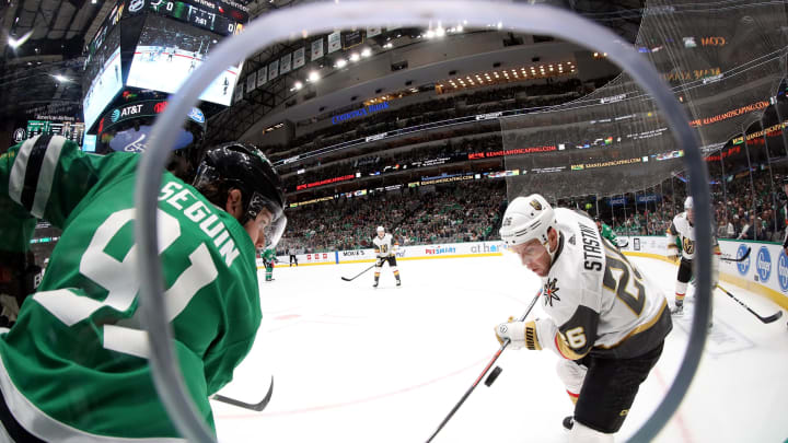 Tyler Seguin of the Dallas Stars battles Paul Stastny of the Vegas Golden Knights for the puck in the first period at American Airlines Center on December 13, 2019.