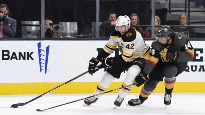 LAS VEGAS, NEVADA - OCTOBER 08: David Backes #42 of the Boston Bruins skates with the puck against Nicolas Hague #14 of the Vegas Golden Knights in the first period of their game at T-Mobile Arena on October 8, 2019 in Las Vegas, Nevada. The Bruins defeated the Golden Knights 4-3. (Photo by Ethan Miller/Getty Images)