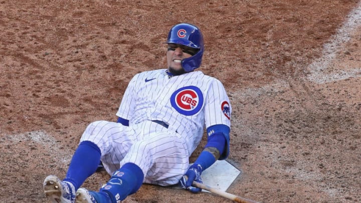 CHICAGO, ILLINOIS - OCTOBER 02: Javier Baez #9 of the Chicago Cubs hits the ground after fouling a ball off of himself in the 9th inning against the Miami Marlins during Game Two of the National League Wild Card Series at Wrigley Field on October 02, 2020 in Chicago, Illinois. The Marlins defeated the Cubs 2-0. (Photo by Jonathan Daniel/Getty Images)