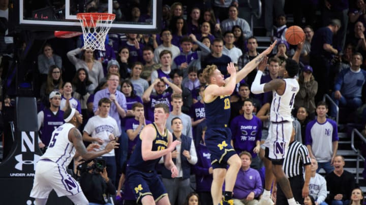 EVANSTON, IL - DECEMBER 04: Vic Law #4 of the Northwestern Wildcats takes a shot in the final minute in the game against the Michigan Wolverines in the second half at Welsh-Ryan Arena on December 4, 2018 in Evanston, Illinois. (Photo by Justin Casterline/Getty Images)