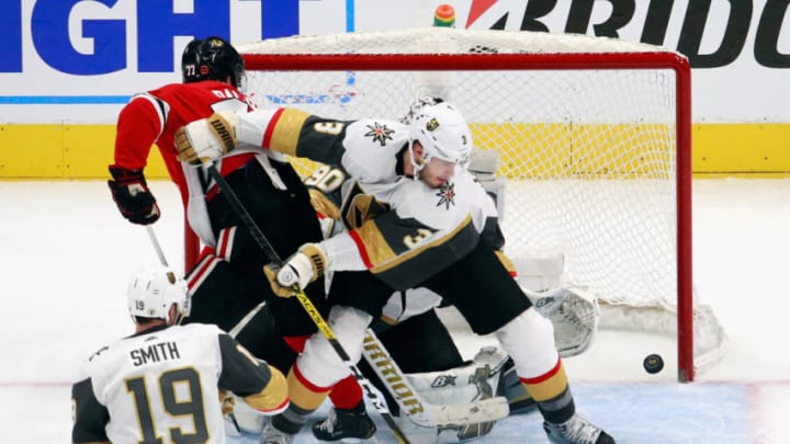 Brayden McNabb #3 of the Vegas Golden Knights defends the net against Kirby Dach #77 of the Chicago Blackhawks in Game Four of the Western Conference First Round. (Photo by Jeff Vinnick/Getty Images)