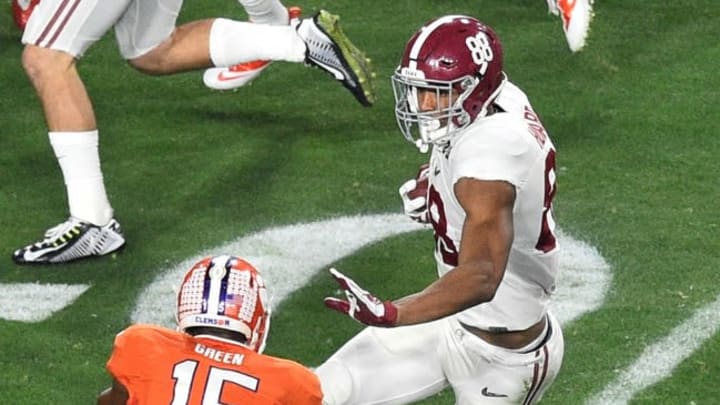 Jan 11, 2016; Glendale, AZ, USA; Alabama Crimson Tide tight end O.J. Howard (88) runs the ball while defended by Clemson Tigers safety T.J. Green (15) during the first quarter in the 2016 CFP National Championship at University of Phoenix Stadium. Mandatory Credit: Gary A. Vasquez-USA TODAY Sports