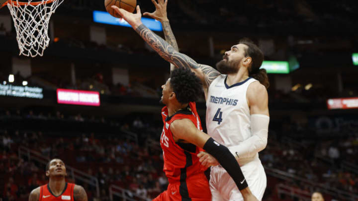 Mar 20, 2022; Houston, Texas, USA; Houston Rockets center Christian Wood (35) attempts to get a rebound away from Memphis Grizzlies center Steven Adams (4) during the first quarter at Toyota Center. Mandatory Credit: Troy Taormina-USA TODAY Sports