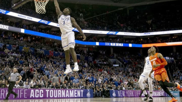 Duke's Zion Williamson (1) glides to the basket for a dunk in the opening minutes of play against Syracuse in the quarterfinals of the ACC Tournament at the Specturm Center in Charlotte, N.C., on Thursday, March 14, 2019. (Robert Willett/Raleigh News & Observer/TNS via Getty Images)
