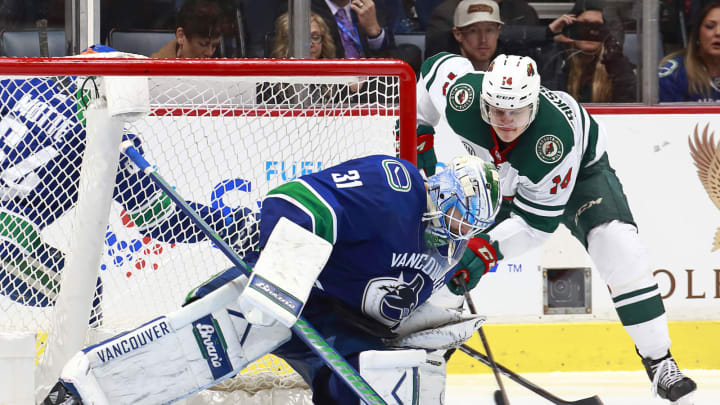 VANCOUVER, BC - DECEMBER 4: Anders Nilsson #31 of the Vancouver Canucks makes a save off the shot of Joel Eriksson Ek #14 of the Minnesota Wild during their NHL game at Rogers Arena December 4, 2018 in Vancouver, British Columbia, Canada. The Wild won 3-2. (Photo by Jeff Vinnick/NHLI via Getty Images)