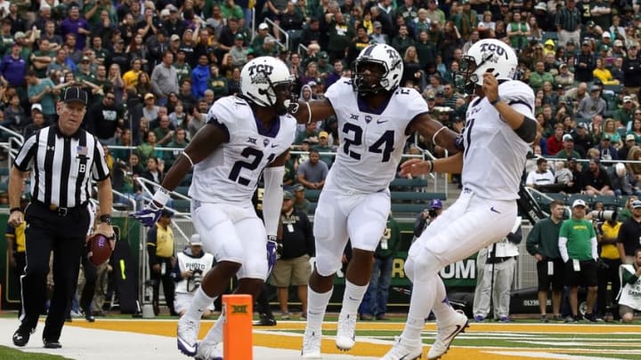 TCU Horned Frogs running back Kyle Hicks (21) celebrates his six-yard touchdown run with running back Trevorris Johnson (24) and quarterback Kenny Hill (7) – Mandatory Credit: Ray Carlin-USA TODAY Sports