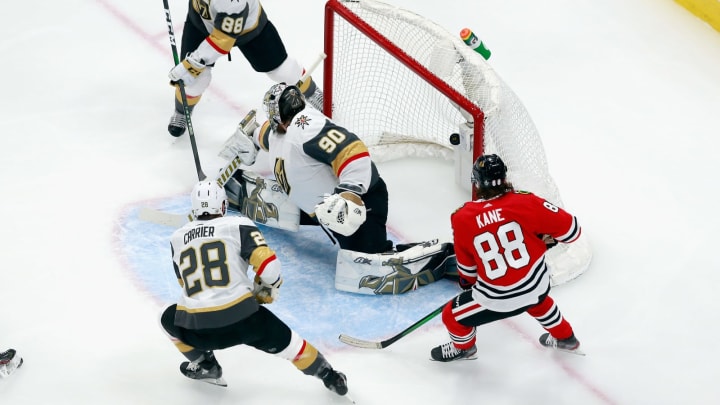 Patrick Kane #88 of the Chicago Blackhawks watches a shot get past Robin Lehner #90 of the Vegas Golden Knights