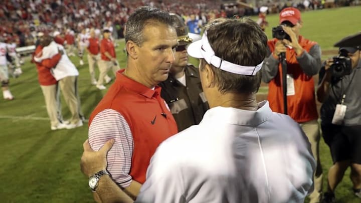 Sep 17, 2016; Norman, OK, USA; Oklahoma Sooners head coach Bob Stoops (right) shakes hands with Ohio State Buckeyes head coach Urban Meyer after the game at Gaylord Family - Oklahoma Memorial Stadium. Mandatory Credit: Kevin Jairaj-USA TODAY Sports