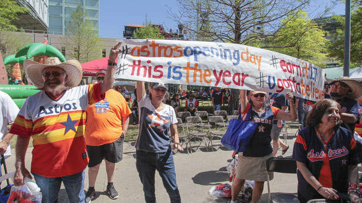 HOUSTON, TX – APRIL 03: Fans carry signs during Houston Sports Astros Fan Fest before playing the Seattle Mariners on opening day at Minute Maid Park on April 3, 2017 in Houston, Texas. (Photo by Bob Levey/Getty Images)