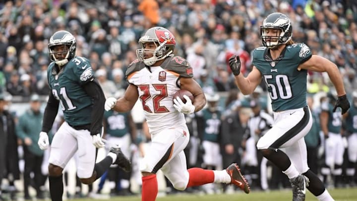 Nov 22, 2015; Philadelphia, PA, USA; Tampa Bay Buccaneers running back Doug Martin (22) runs against Philadelphia Eagles cornerback Byron Maxwell (31) and linebacker Kiko Alonso (50) during the first quarter at Lincoln Financial Field. Mandatory Credit: Eric Hartline-USA TODAY Sports