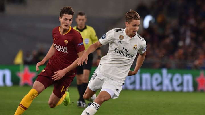 ROME, ITALY - NOVEMBER 27: Marcos Llorente (R) of Real Madrid holds off the challenge from Patrik Schick of Roma during the Group G match of the UEFA Champions League between AS Roma and Real Madrid at Stadio Olimpico on November 27, 2018 in Rome, Italy. (Photo by Tullio Puglia - UEFA/UEFA via Getty Images )