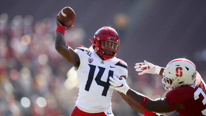 PALO ALTO, CALIFORNIA - OCTOBER 26: Khalil Tate #14 of the Arizona Wildcats is pressured by Thomas Booker #34 of the Stanford Cardinal at Stanford Stadium on October 26, 2019 in Palo Alto, California. (Photo by Ezra Shaw/Getty Images)