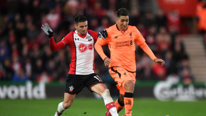 SOUTHAMPTON, ENGLAND – FEBRUARY 11: Roberto Firmino of Liverpool is challenged by Dusan Tadic of Southampton during the Premier League match between Southampton and Liverpool at St Mary’s Stadium on February 11, 2018 in Southampton, England. (Photo by Michael Regan/Getty Images)