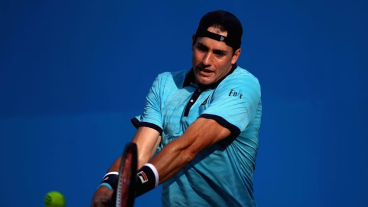 LONDON, ENGLAND - JUNE 20: John Isner of The United States plays a backhand during the mens singles first round match against Marin Cilic of Croatia on day two of the 2017 Aegon Championships at Queens Club on June 20, 2017 in London, England. (Photo by Julian Finney/Getty Images)