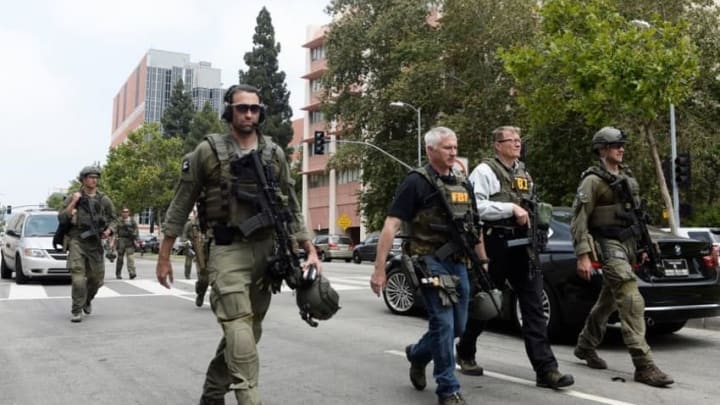 June 1, 2016; Los Angeles, CA, USA; FBI personnel walk down Westwood Blvd. from the UCLA campus after a shooting was reported this morning. Two people were killed in the incident as the campus was on lockdown throughout the morning and early afternoon. Mandatory Credit: Robert Hanashiro-USA TODAY NETWORK