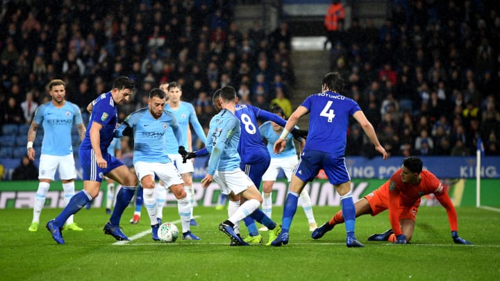 LEICESTER, ENGLAND – DECEMBER 18: Nicolas Otamendi of Manchester City is challenged by Harry Maguire of Leicester City inside of the penalty area during the Carabao Cup Quarter Final match between Leicester City and Manchester United at The King Power Stadium on December 18, 2018 in Leicester, United Kingdom. (Photo by Shaun Botterill/Getty Images)