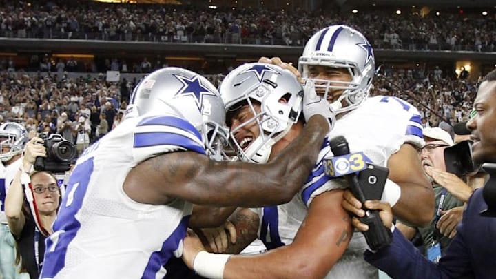 Oct 30, 2016; Arlington, TX, USA; Dallas Cowboys quarterback Dak Prescott (4) celebrates with Dallas Cowboys wide receiver Dez Bryant (88) after the game against the Philadelphia Eagles at AT&T Stadium. Dallas Cowboys won 29-23. Mandatory Credit: Tim Heitman-USA TODAY Sports