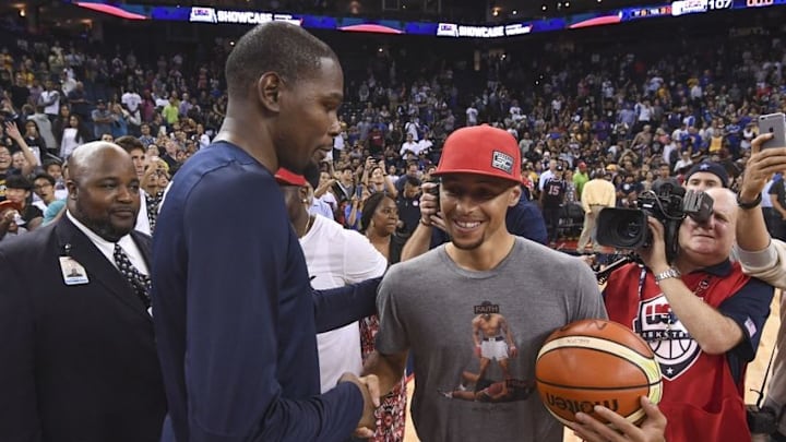 July 26, 2016; Oakland, CA, USA; USA guard Kevin Durant (5, left) shakes hands with Golden State Warriors guard Stephen Curry (right) after an exhibition basketball game at Oracle Arena. USA defeated China 107-57. Mandatory Credit: Kyle Terada-USA TODAY Sports