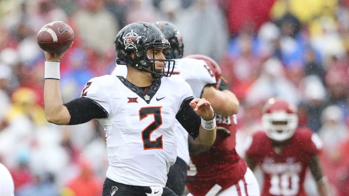 Dec 3, 2016; Norman, OK, USA; Oklahoma State Cowboys quarterback Mason Rudolph (2) throws during the first quarter against the Oklahoma Sooners at Gaylord Family – Oklahoma Memorial Stadium. Mandatory Credit: Kevin Jairaj-USA TODAY Sports