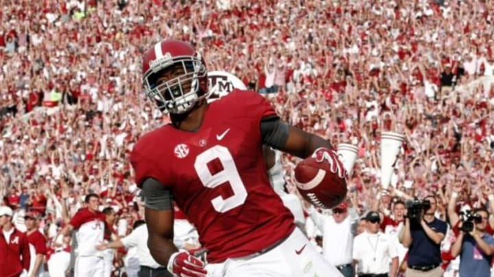 Oct 18, 2014; Tuscaloosa, AL, USA; Alabama Crimson Tide wide receiver Amari Cooper (9) catches a pass for a touchdown against the Texas A&M Aggies at Bryant-Denny Stadium. Mandatory Credit: Marvin Gentry-USA TODAY Sports