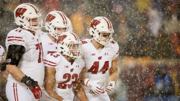 MINNEAPOLIS, MINNESOTA - NOVEMBER 30: The Wisconsin Badgers celebrate a touchdown by Jonathan Taylor #23 of the Wisconsin Badgers during the game at TCF Bank Stadium on November 30, 2019 in Minneapolis, Minnesota. The Badgers defeated the Golden Gophers 38-17. (Photo by Hannah Foslien/Getty Images)