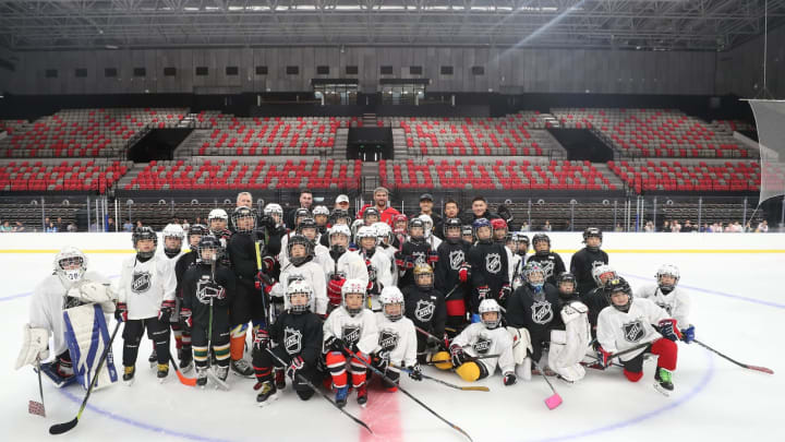 Washington Capitals forward Alex Ovechkin takes a group photo with children at Shougang Rink after having a positive impact on the sport of hockey in China.