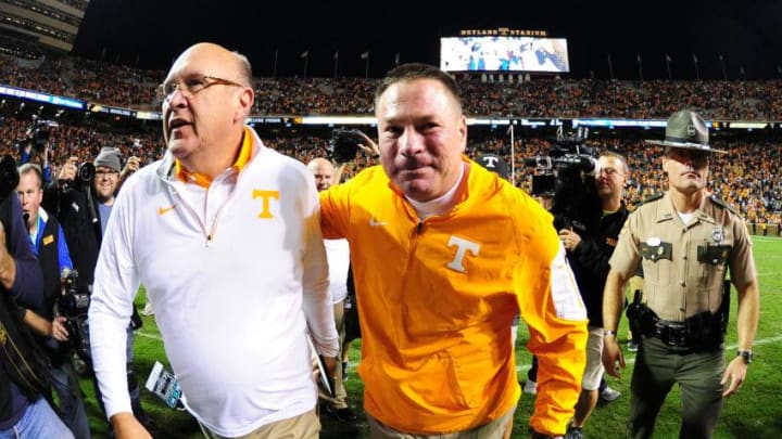 KNOXVILLE, TN - OCTOBER 10: Head Coach Butch Jones (R) of the Tennessee Volunteers celebrates with Offensive Coordintator Mike DeBord after the game against the Georgia Bulldogs on October 10, 2015 at Neyland Stadium in Knoxville, Tennessee. (Photo by Scott Cunningham/Getty Images)