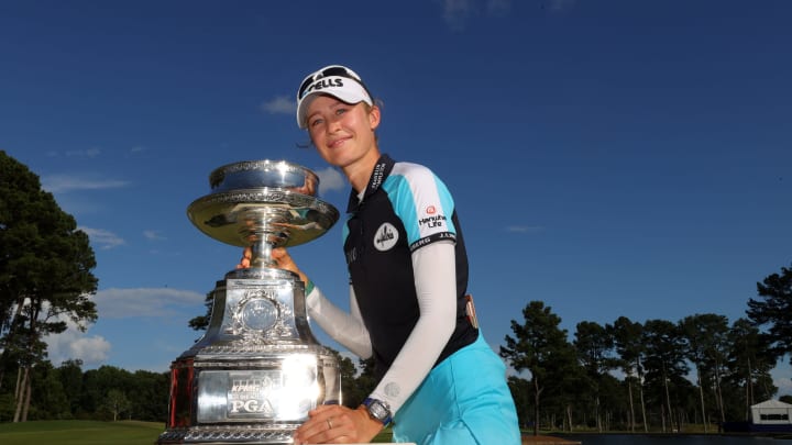 JOHNS CREEK, GEORGIA – JUNE 27: Nelly Korda poses with the trophy after putting in to win on the 18th green during the final round of the KPMG Women’s PGA Championship at Atlanta Athletic Club on June 27, 2021 in Johns Creek, Georgia. (Photo by Kevin C. Cox/Getty Images)