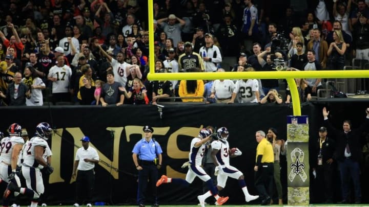 Nov 13, 2016; New Orleans, LA, USA; Denver Broncos defensive back Will Parks (34) returns a blocked extra point for two points during the fourth quarter of a game against the New Orleans Saints at the Mercedes-Benz Superdome. The Broncos defeated the Saints 25-23. Mandatory Credit: Derick E. Hingle-USA TODAY Sports