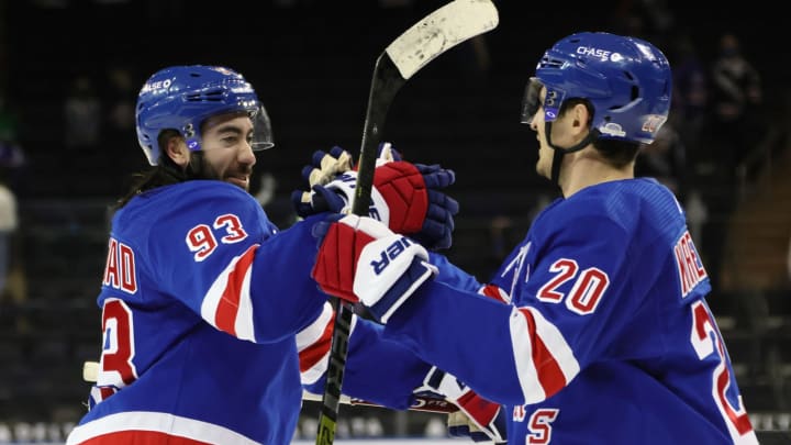 NEW YORK, NEW YORK – MARCH 22: Mika Zibanejad #93and Chris Kreider #20 of the New York Rangers celebrate their 5-3 victory over the Buffalo Sabres at Madison Square Garden on March 22, 2021 in New York City. (Photo by Bruce Bennett/Getty Images)