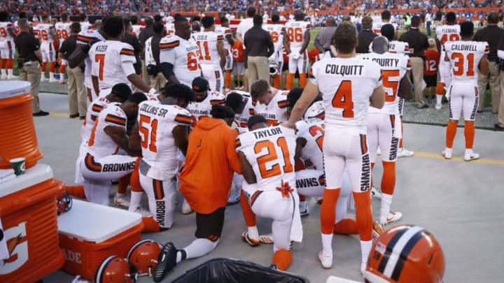 CLEVELAND, OH - AUGUST 21: A group of Cleveland Browns players kneel in a circle in protest during the national anthem prior to a preseason game against the New York Giants at FirstEnergy Stadium on August 21, 2017 in Cleveland, Ohio. (Photo by Joe Robbins/Getty Images)