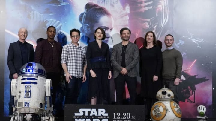 TOKYO, JAPAN - DECEMBER 12: (L-R) Anthony Daniels, John Boyega, J.J. Abrams, Daisy Ridley, Oscar Isaac, Kathleen Kennedy, and Chris Terrio pose for photos with Star Wars characters R2-D2, BB-8, and D-O at the press conference for 'Star Wars: The Rise of Skywalker' at Toho Cinemas Roppongi on December 12, 2019 in Tokyo, Japan. (Photo by Christopher Jue/Getty Images for Disney)