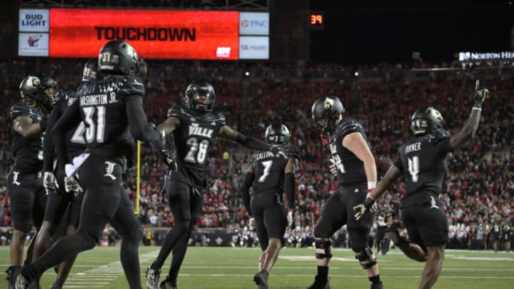 Nov 9, 2023; Louisville, Kentucky, USA; The Louisville Cardinals celebrate after a blocked Virginia Cavaliers punt was return for a touchdown during the first half at L&N Federal Credit Union Stadium. Mandatory Credit: Jamie Rhodes-USA TODAY Sports