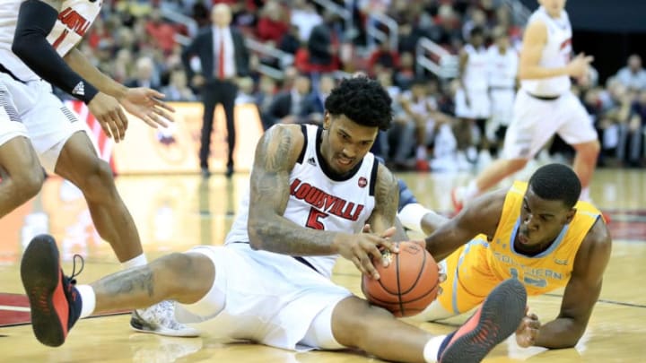 LOUISVILLE, KY - NOVEMBER 13: Malik Williams #5 of the Louisville Cardinals and Alex Ennis #12 of the Southern Jaguars battle for a loose ball during the game at KFC YUM! Center on November 13, 2018 in Louisville, Kentucky. (Photo by Andy Lyons/Getty Images)