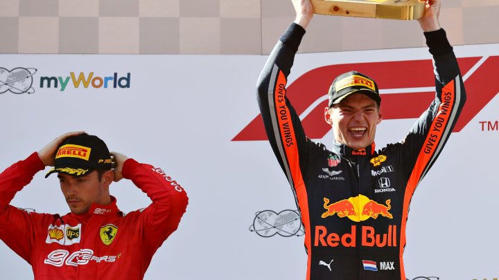 SPIELBERG, AUSTRIA – JUNE 30: Race winner Max Verstappen of Netherlands and Red Bull Racing celebrates on the podium as second placed Charles Leclerc of Monaco and Ferrari (Photo by Mark Thompson/Getty Images)