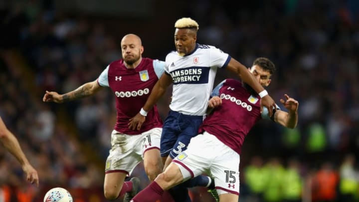 BIRMINGHAM, ENGLAND - MAY 15: Alan Hutton of Aston Villa battles for possession with Adama Traore of Middlesbrough and Mile Jedinak of Aston Villa during the Sky Bet Championship Play Off Semi Final:Second Leg match between Aston Villa and Middlesbrough at Villa Park on May 15, 2018 in Birmingham, England. (Photo by Clive Mason/Getty Images)