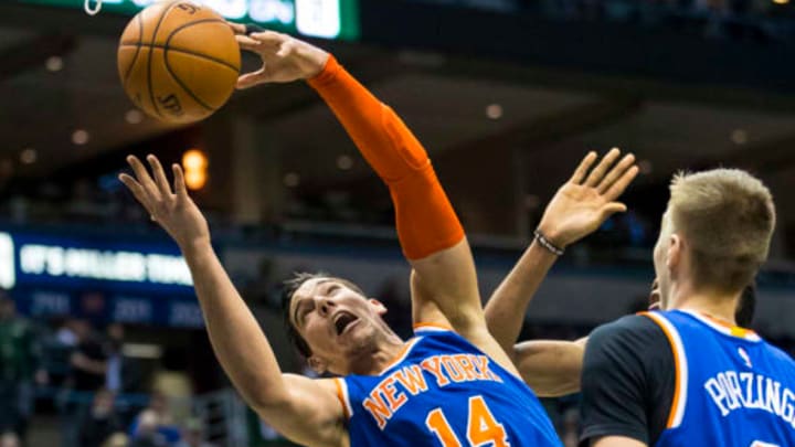 Mar 8, 2017; Milwaukee, WI, USA; New York Knicks center Willy Hernangomez (14) reaches for a rebound during the third quarter against the Milwaukee Bucks at BMO Harris Bradley Center. Mandatory Credit: Jeff Hanisch-USA TODAY Sports