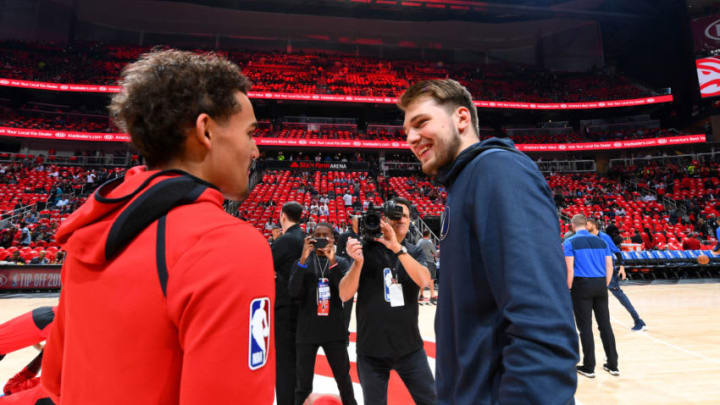 ATLANTA, GA - OCTOBER 24: Trae Young #11 of the Atlanta Hawks and Luka Doncic #77 of the Dallas Mavericks talk before the game on October 24, 2018 at State Farm Arena in Atlanta, Georgia. NOTE TO USER: User expressly acknowledges and agrees that, by downloading and/or using this photograph, user is consenting to the terms and conditions of the Getty Images License Agreement. Mandatory Copyright Notice: Copyright 2018 NBAE (Photo by Scott Cunningham/NBAE via Getty Images)