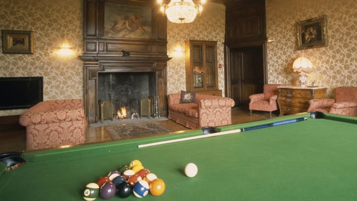 FRANCE – APRIL 28: Room with fireplace and billiard table, Castle of Salles, 15th century, Vezac, Auvergne, France. (Photo by DeAgostini/Getty Images)