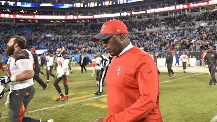 Jan 3, 2016; Charlotte, NC, USA; Tampa Bay Buccaneers head coach Lovie Smith walks on to the field at the end of the game. The Panthers defeated the Buccaneers 38-10 at Bank of America Stadium. Mandatory Credit: Bob Donnan-USA TODAY Sports